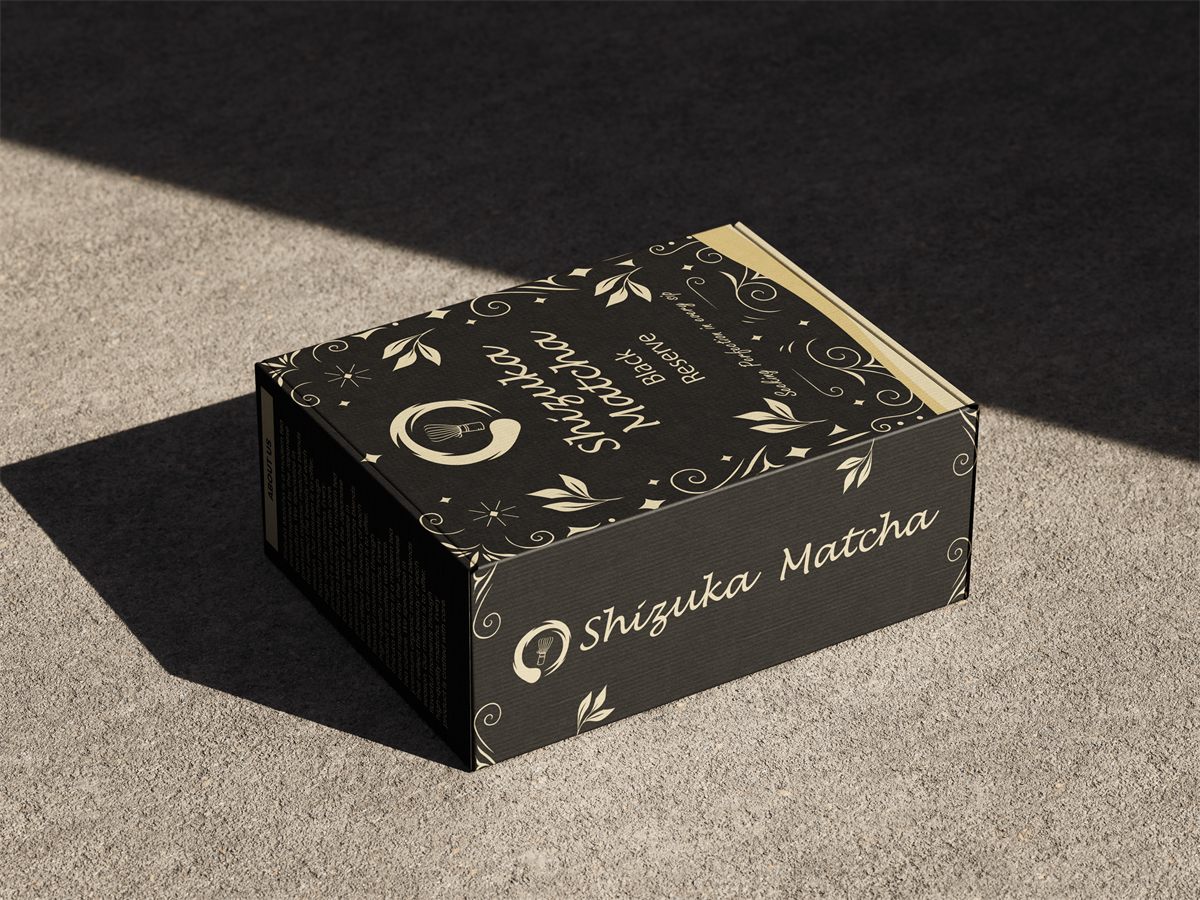 Shizuka Matcha Black Reserve box on a concrete surface in natural light