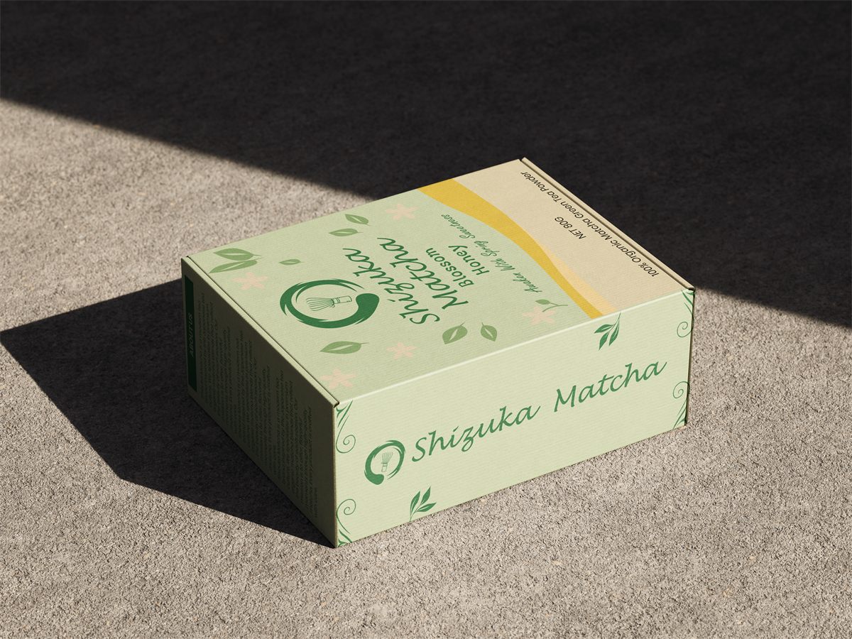 Shizuka Matcha Honey Blossom box on a concrete surface in natural light