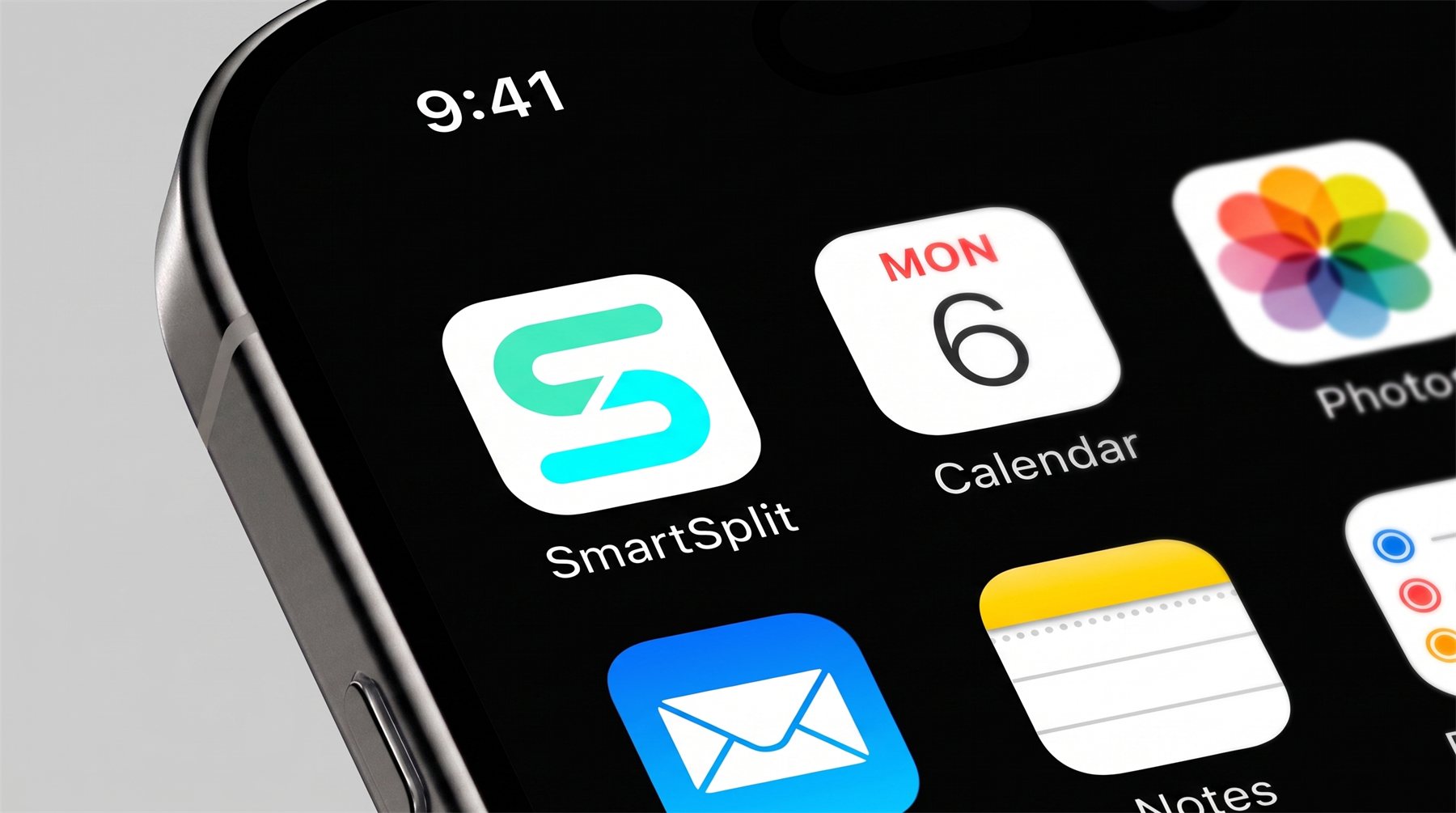 Macro shot of the SmartSplit app icon on an iPhone home screen next to the Calendar and Photos icons