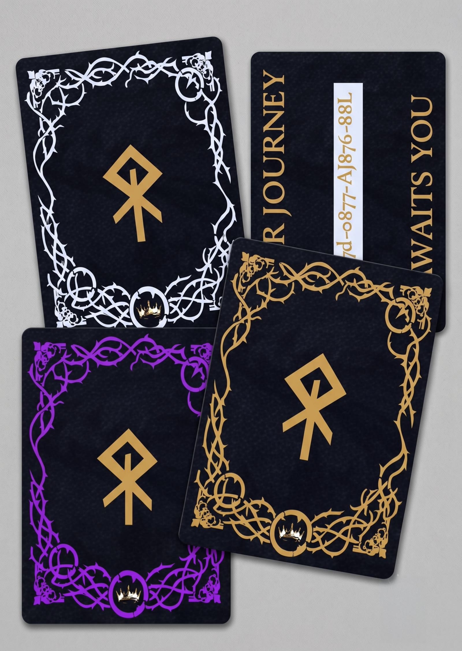 Four artifact reward cards in different rarity colors, fanned out with a redeem code card