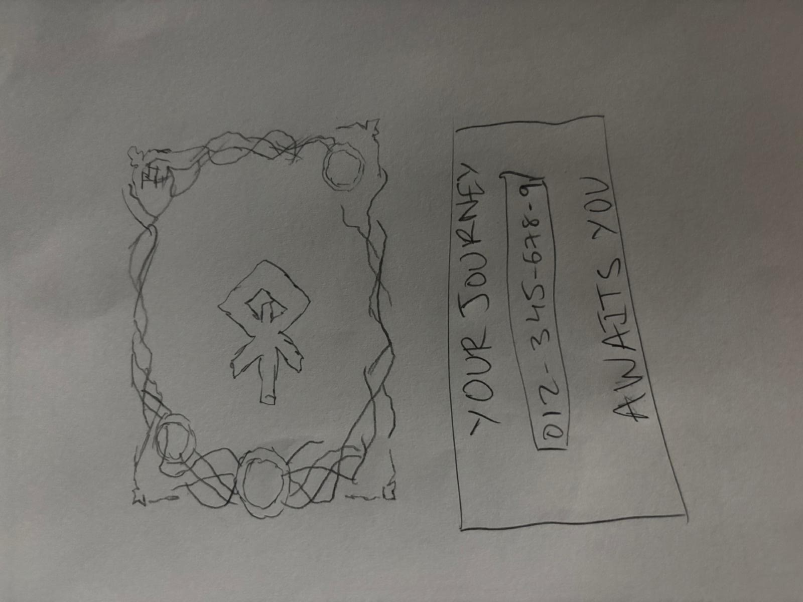 Hand drawn sketch of the artifact card front and its redeem code back